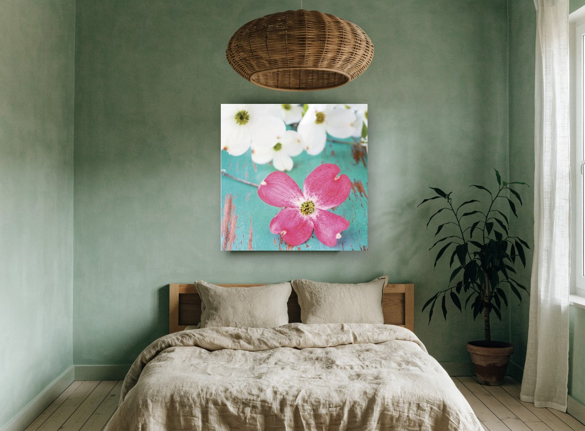 Pink Dogwood on Teal floral canvas print on the wall of a bedroom