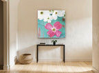 Pink Dogwood on Teal floral canvas print on the wall of a hallway