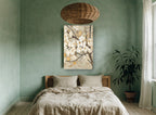 Gilded Magnolia Branch floral canvas print on the wall of a bedroom