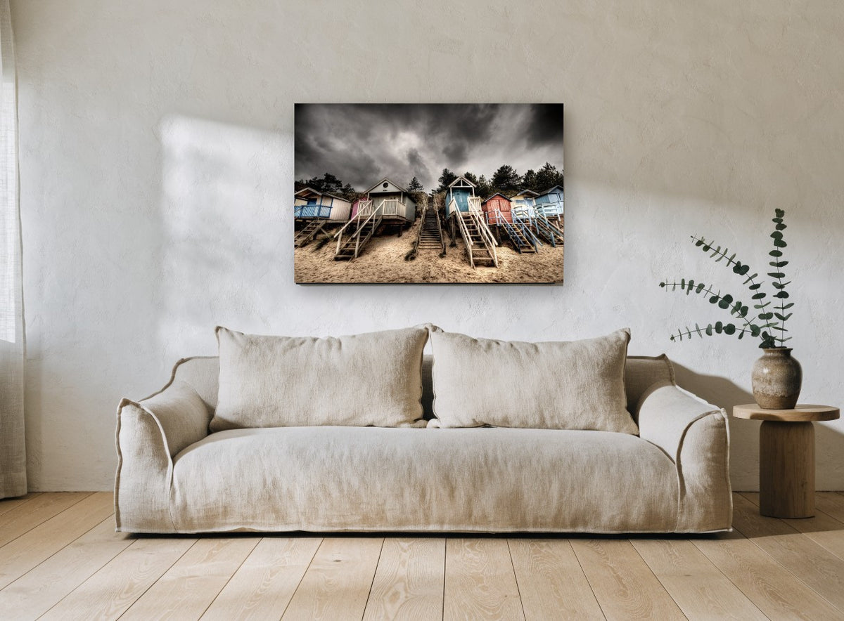 Stormy Beach Hut Stairs coastal canvas print on the wall of a living room