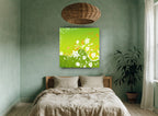 Green Meadow Swirl floral canvas print on the wall of a bedroom