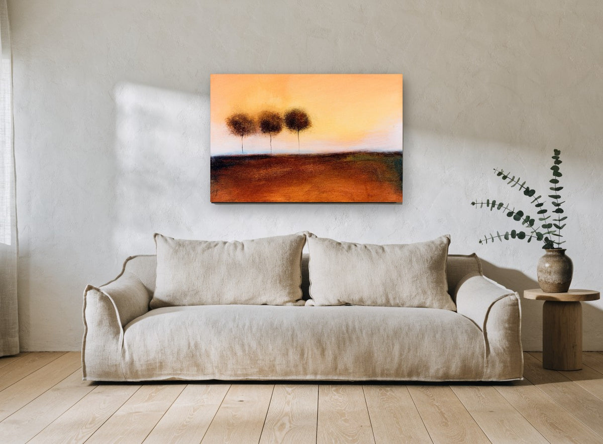 Three Trees at Dusk floral canvas print on the wall of a living room