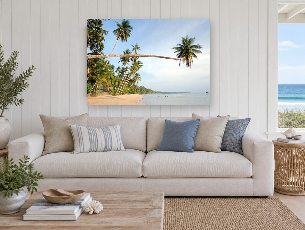 Leaning Palm Bay coastal canvas print on the wall of a beach house living room
