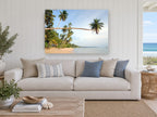 Leaning Palm Bay coastal canvas print on the wall of a beach house living room
