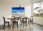 Glassy Shore Break coastal canvas print on the wall of a dining room