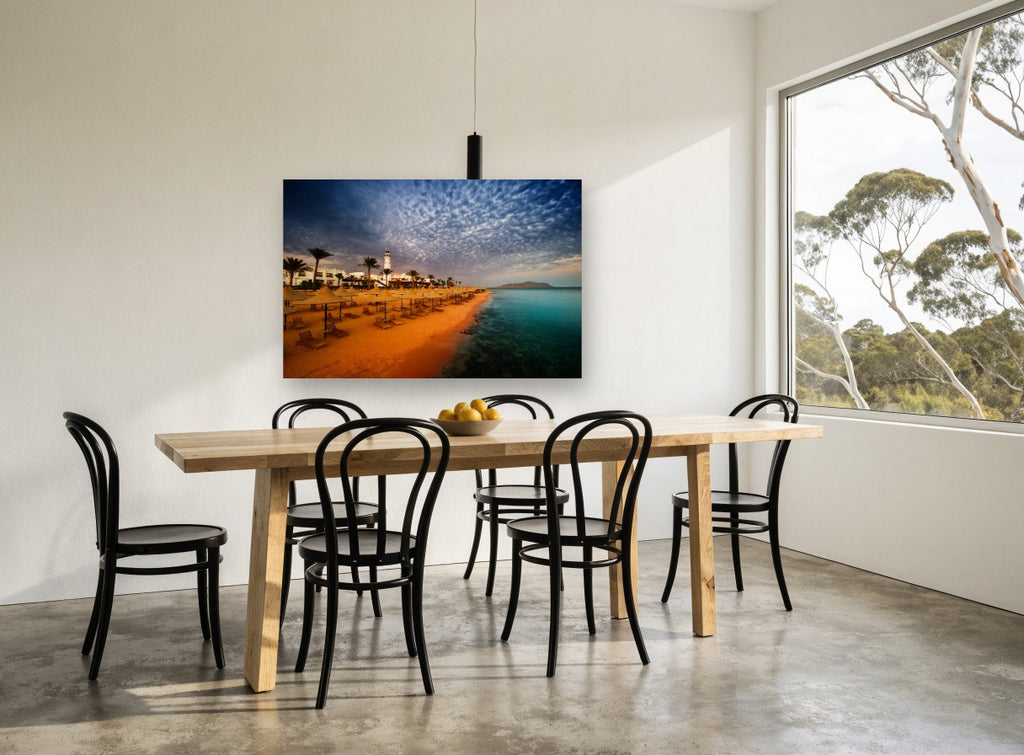 Dusk Over Straw Umbrellas coastal canvas print on the wall of a dining room