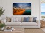 Dusk Over Straw Umbrellas coastal canvas print on the wall of a beach house living room