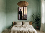 Man at the Paris Window city canvas print on the wall of a bedroom