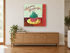 Greetings Cupcake kitchen canvas print on the wall of a living room above a sideboard