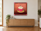 Cherry Swirl Cupcake kitchen canvas print on the wall of a living room above a sideboard