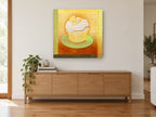 Lemon Chiffon Cupcake kitchen canvas print on the wall of a living room above a sideboard