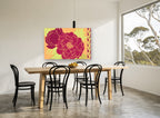 Crimson Peony Duo floral canvas print on the wall of a dining room