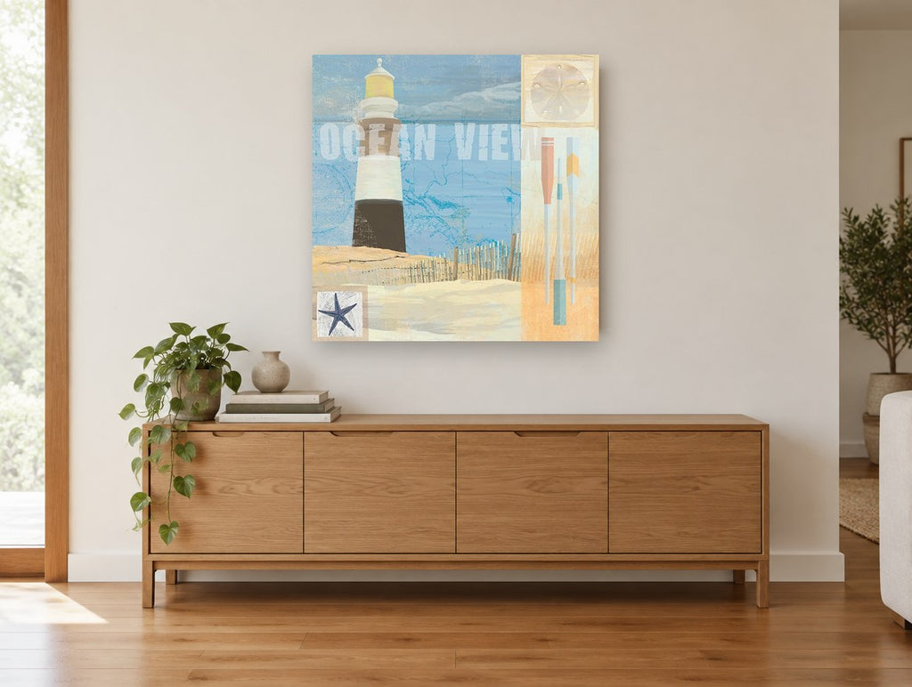 Ocean View Beacon coastal canvas print on the wall of a living room above a sideboard