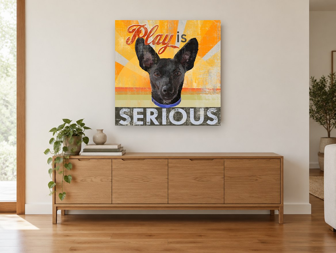Play Is Serious Pup animal canvas print on the wall of a living room above a sideboard