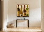 Four Wine Bottles vintage canvas print on the wall of a hallway