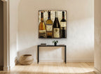 Four European Wine Bottles vintage canvas print on the wall of a hallway