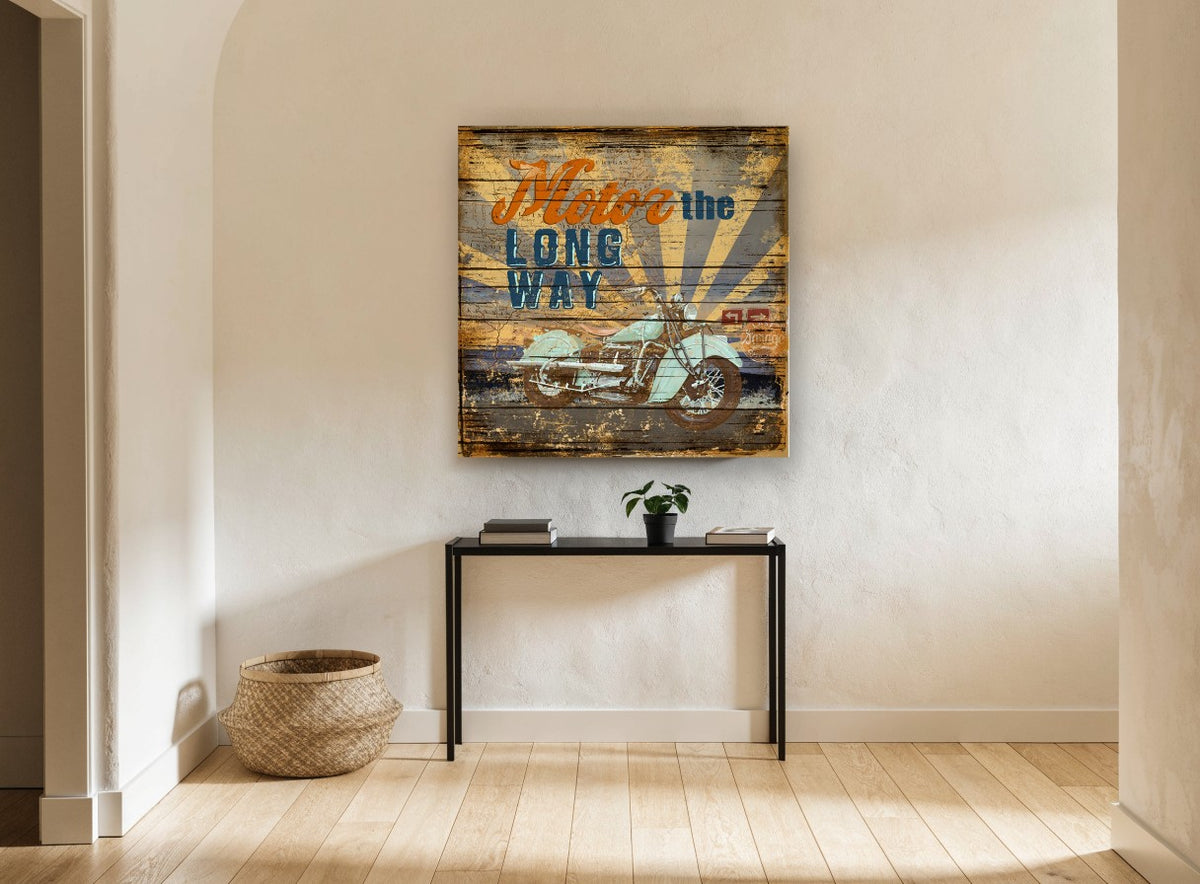 Motor the Long Way vintage canvas print on the wall of a hallway
