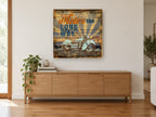 Motor the Long Way vintage canvas print on the wall of a living room above a sideboard