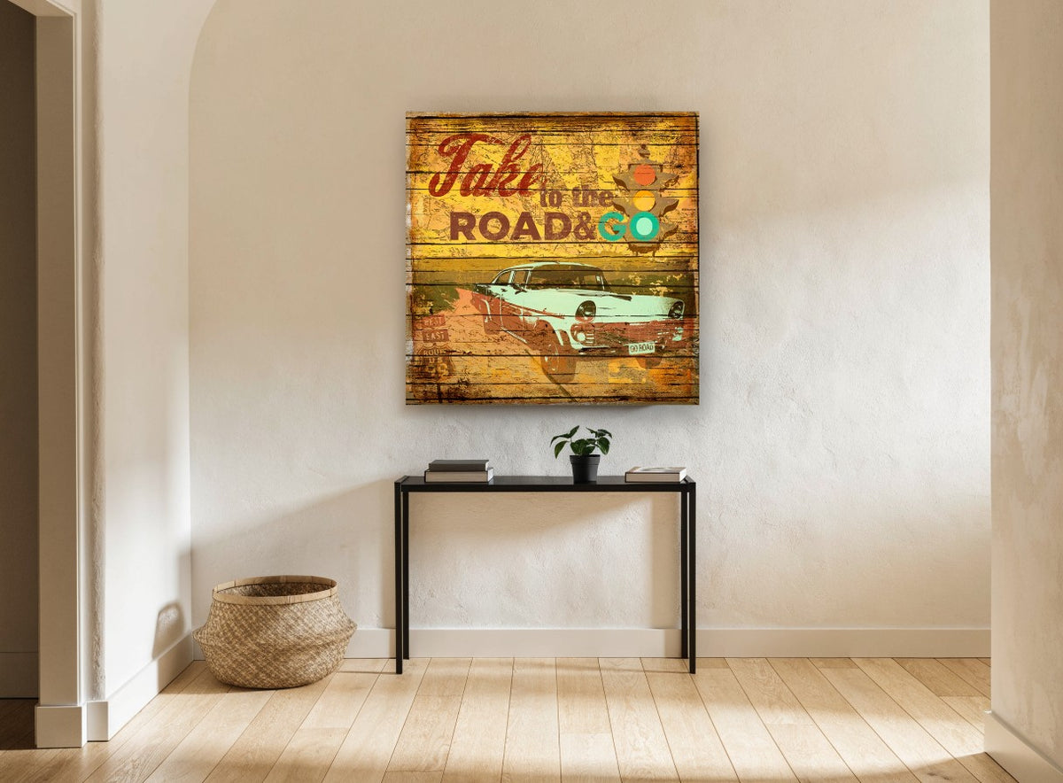 Take to the Road vintage canvas print on the wall of a hallway
