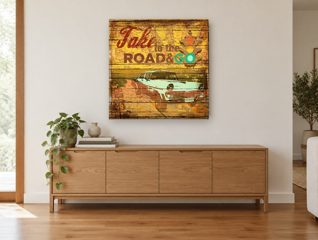 Take to the Road vintage canvas print on the wall of a living room above a sideboard