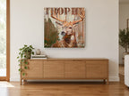 Weathered Plank Stag animal canvas print on the wall of a living room above a sideboard