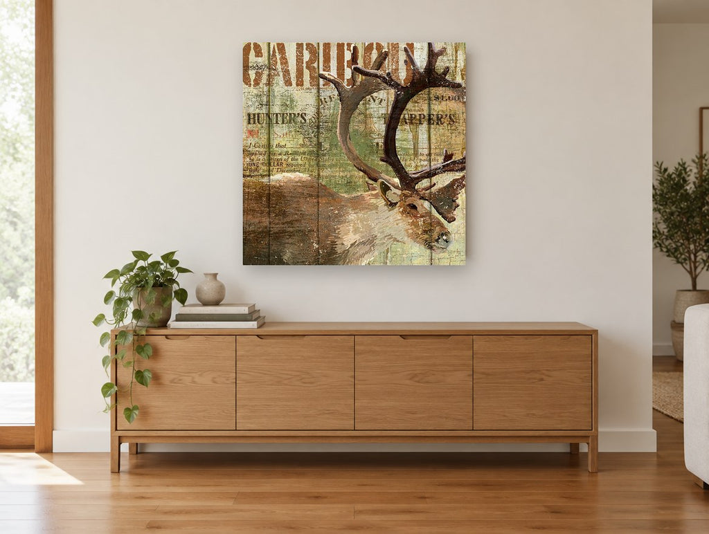 Caribou Hunter's Lodge animal canvas print on the wall of a living room above a sideboard