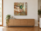 Mallard on Weathered Boards animal canvas print on the wall of a living room above a sideboard