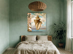 Conch and Lighthouse Collage coastal canvas print on the wall of a bedroom