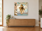 Conch and Lighthouse Collage coastal canvas print on the wall of a living room above a sideboard