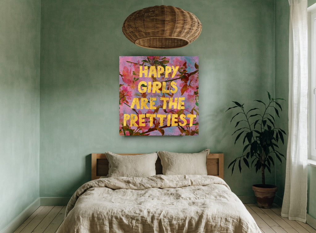 Happy Girls Blossom Typography floral canvas print on the wall of a bedroom