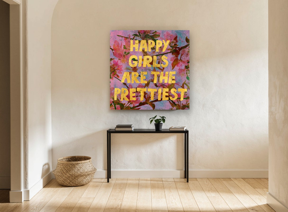 Happy Girls Blossom Typography floral canvas print on the wall of a hallway