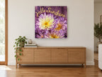 Purple Chrysanthemum Sunshine floral canvas print on the wall of a living room above a sideboard