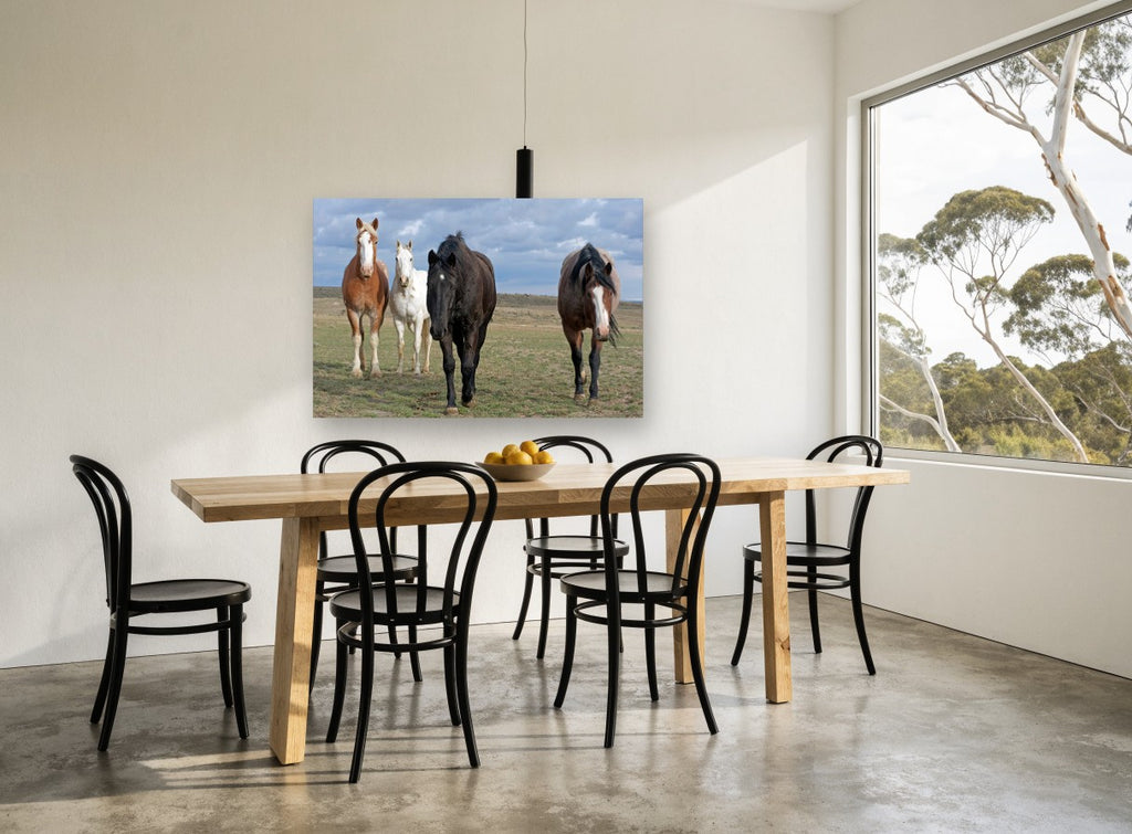 Four Across the Plain landscape canvas print on the wall of a dining room