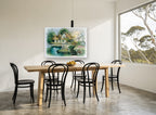 Swan Pond Cottage vintage canvas print on the wall of a dining room