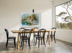 Swan Pond Cottage vintage canvas print on the wall of a dining room