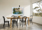Swan Pond Cottage vintage canvas print on the wall of a dining room