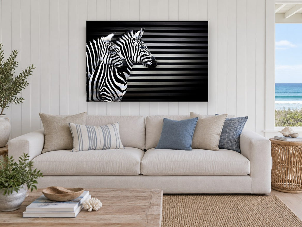 Striped Zebra Trio animal canvas print on the wall of a beach house living room