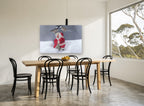 Chickadees Meet Santa animal canvas print on the wall of a dining room