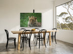 Leopard in Wet Grass animal canvas print on the wall of a dining room