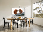 Winter Squirrel Pair landscape canvas print on the wall of a dining room