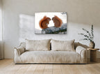 Winter Squirrel Pair landscape canvas print on the wall of a living room