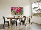 Crimson Garden Bloom floral canvas print on the wall of a dining room