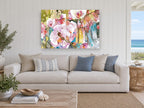 Orchid Garden Glow floral canvas print on the wall of a beach house living room