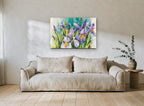 Iris Garden Teal floral canvas print on the wall of a living room