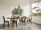 Iris Garden Bloom floral canvas print on the wall of a dining room