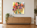 Iris Trio Glow floral canvas print on the wall of a living room above a sideboard