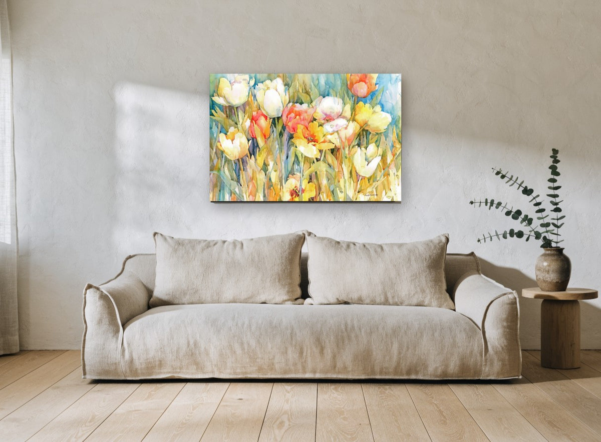 Sunlit Tulip Garden floral canvas print on the wall of a living room