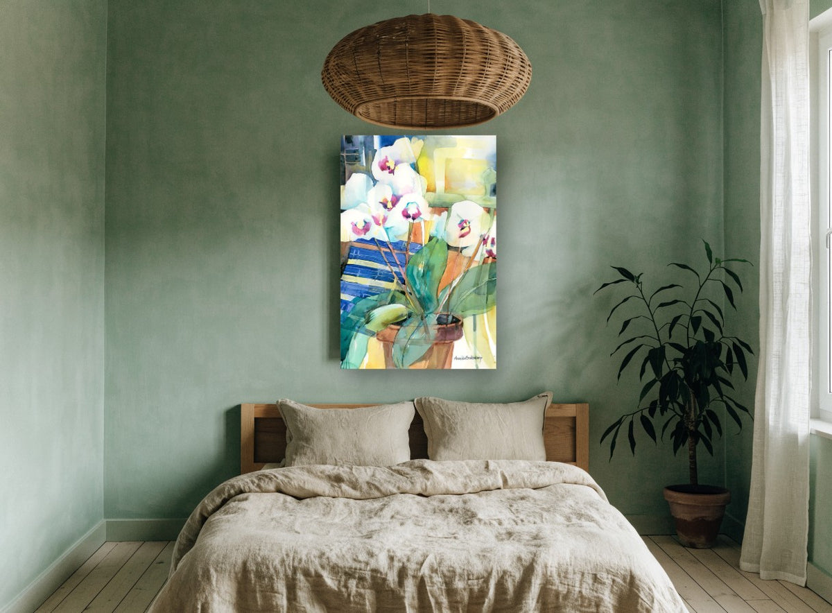 White Orchids on Blue floral canvas print on the wall of a bedroom