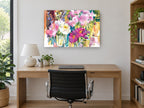Peony Bouquet Drips floral canvas print on the wall of a study