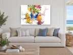 Blue Jug and Pears floral canvas print on the wall of a beach house living room